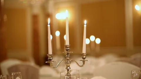 Served table with dishes and candles in a restaurant Stock Footage 121286575