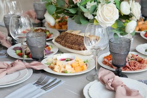 Served table next to the decor. Wedding decoration. Close-up. Stock Photos