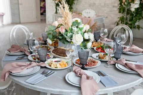 Served table next to the decor. Wedding decoration. Close-up. Stock Photos
