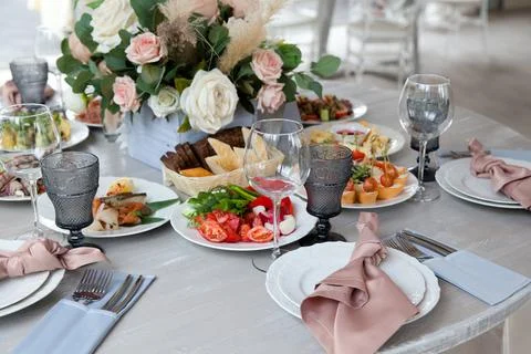 Served table next to the decor. Wedding decoration. Close-up. Stock Photos