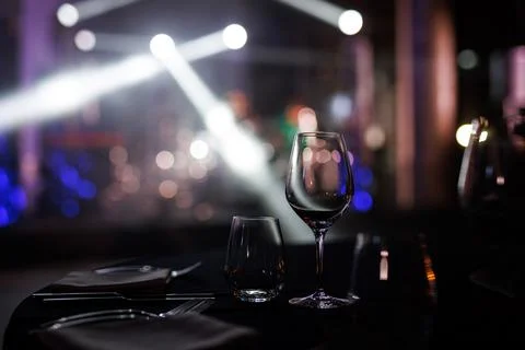 Served table in a restaurant at the holiday. Empty glasses before the event Stock Photos
