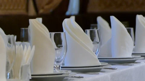 Served table in the restaurant with plates, glasses, napkins and forks. The Stock Footage 92755091