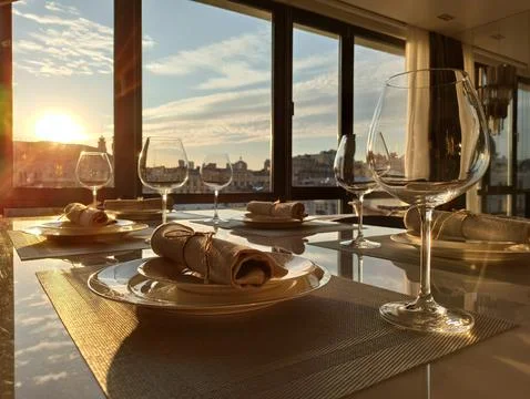 Served table in a restaurant at sunset Foto stock