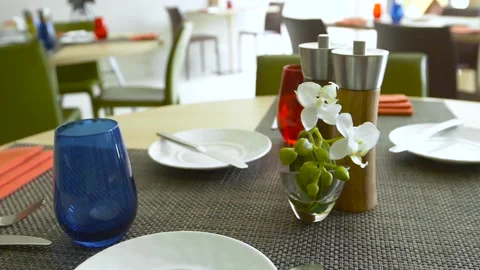 Served table in the restaurant with tableware and flowers Stock Footage 92256243