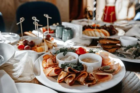 Served table in a restaurant with various snacks close-up Stock Photos