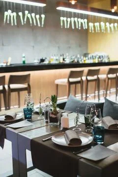 Served table for several persons in a restaurant Stock Photos