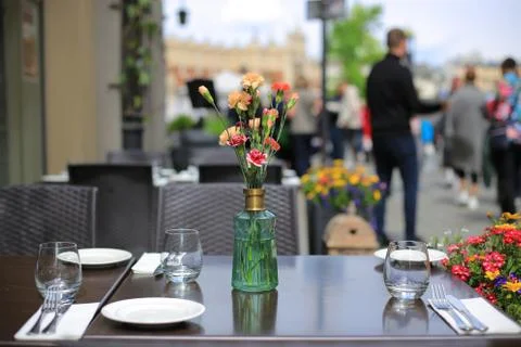 Served table summer cafe with flowers Stockfoto's