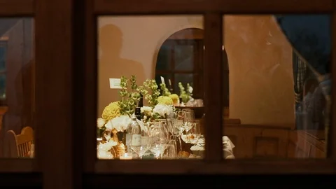 Served Tables For Guests At The Wedding. View Through Window From The Street. Video stock 112735577
