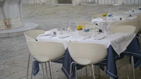 Served tables outside of restaurant waiting for clients Stock Footage 76815285