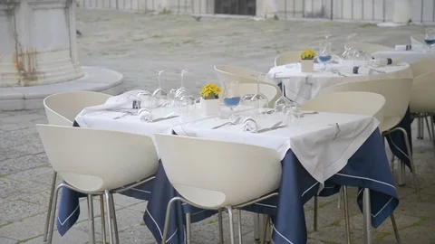 Served tables outside of restaurant waiting for clients Stock Footage 76815440