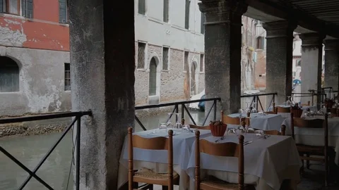 Served tables outside of restaurant waiting for clients Stock Footage 76884577