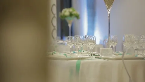 Served tables with wine glasses, white tablecloth and wooden chairs of wedding Video stock 71996203
