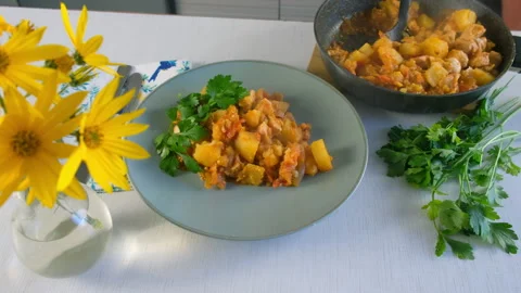 Served vegetables potatoes and chicken meat fresh stew with parsley on plate. Stock Footage 312470099