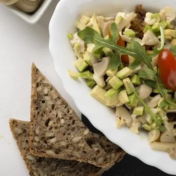 Served vegetarian salad with bread 库存照片
