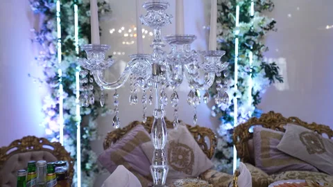 Served wedding table with elegant high crystal candlestick Stock Footage 213997859