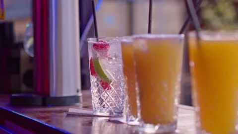 Server Adds a Drinking Straw to a Tray of Soft Drinks Stock Footage 204924397