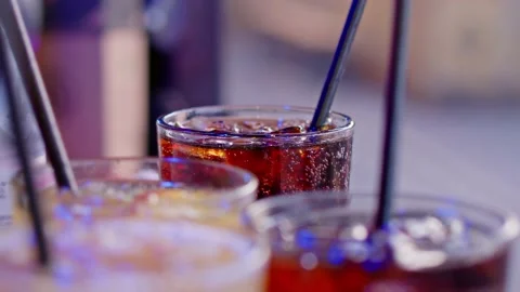 Server Collects Tray of Drinks from the Pass at an Outdoor Bar Stockbeeldmateriaal 204924539