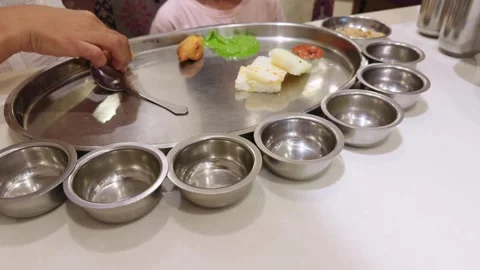 Server delivers the meal to the customer on a platter Video stock 295924584