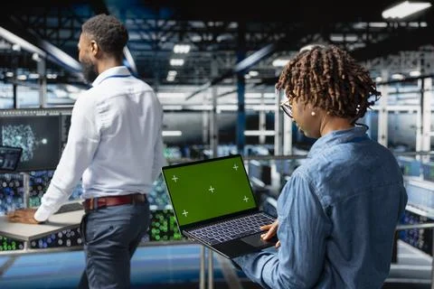 Server farm black engineer holding isolated screen on tablet Foto stock