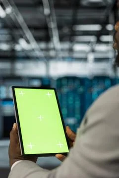 Server farm computer scientist using mockup tablet to repair equipment Stock Photos