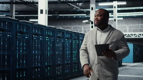 Server farm employee upgrading gear for increased processing Stock Footage 311833120