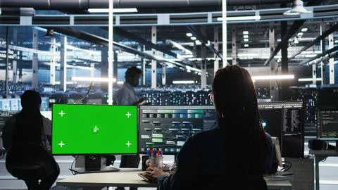 Server farm engineer using node tree systems on green screen PC Stock Photos