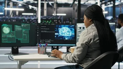 Server farm engineering team collaborating to protect against data theft Stock Photos