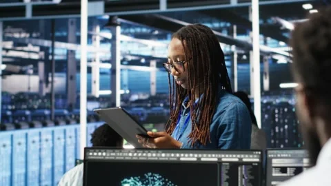 Server farm engineering team using AI algorithms and node tree systems Stock Footage 309506939