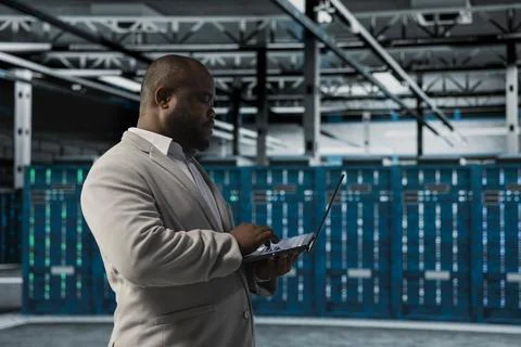 Server farm IT expert doing hardware scans, fixing network issues Stock Photos