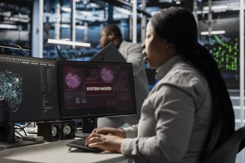 Server farm IT expert trying to repair compromised hardware after hacker attack Foto stock