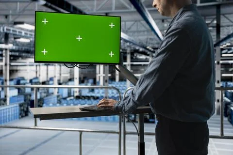 Server farm IT expert uses mockup computer, managing infrastructure resources Stock Photos