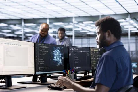 Server farm IT specialist using AI systems to input data faster 스톡 사진