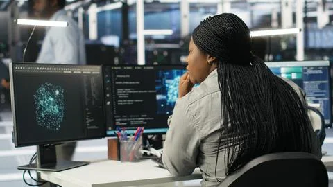 Server farm IT specialist using PC to apply artificial intelligence Stock Photos