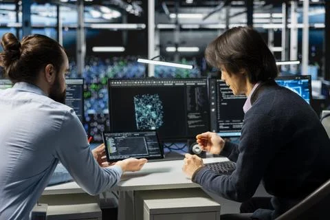 Server farm IT workers deploying artificial intelligence tools to automate 写真素材