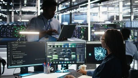 Server farm manager supervising engineer using node tree systems Stock Photos
