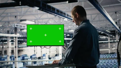 Server farm programmer using green screen computer to scan hardware rigs Stock Footage 314803495