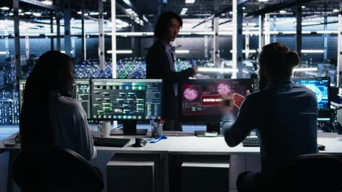 Server farm programmers seeing hacking warning, working to secure systems Stock Footage 313568931