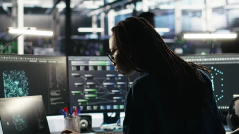 Server farm software developer interprets AI generated data analytics graphs Stock Footage 307022072