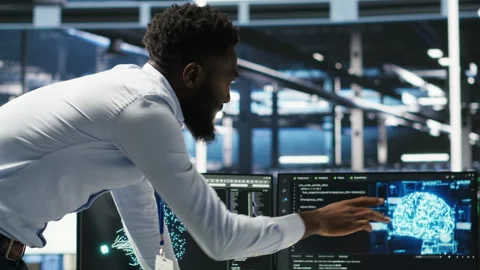 Server farm supervisor and man with disability oversee AI analytics Video stock 307321717