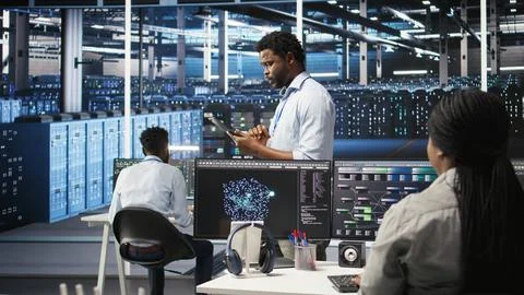 Server farm technician using AI algorithms and node tree systems Stock Photos