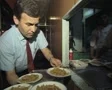 Server filling tray with plates of food on train SD Footage