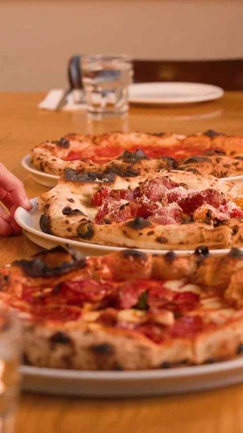Server Hand Picking Up Neapolitan Pizza Plate From Restaurant Table Stock Footage 338375109