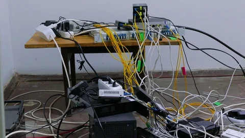 Server hardware and switches are scattered in the room 스톡 동영상 87023336