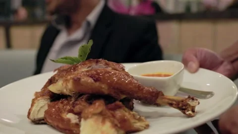 Server holding plate of chicken, crispy skin, golden, restaurant, dine out. 4K Stock Footage 162144739