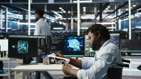 Server hub admin with paraplegia receiving paperwork documents from colleague Stock Footage 307035318