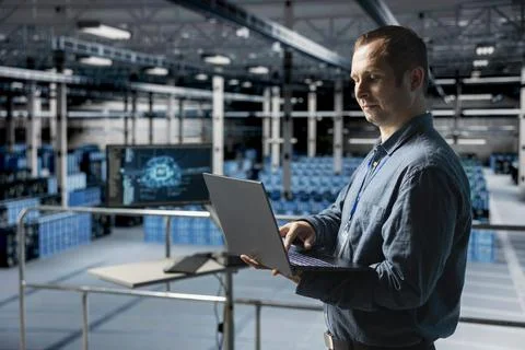 Server hub computer scientist debugging machine learning scripts on laptop Stock Photos