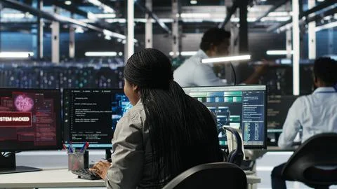 Server hub coworkers react to security breach after unauthorized access Stock Photos