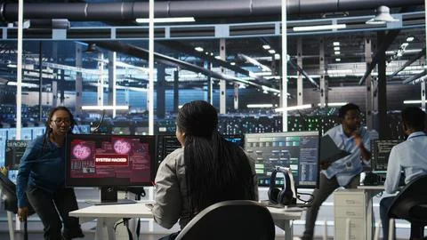 Server hub coworkers react to security breach after unauthorized access Stock Photos