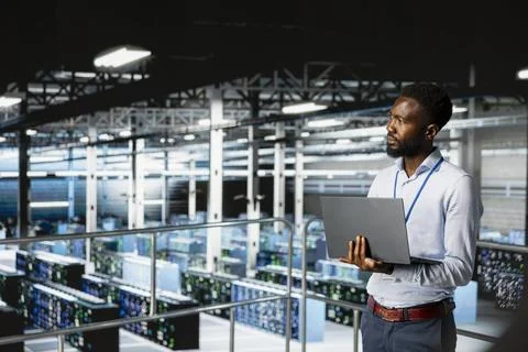 Server hub employee visualizing large language AI model using laptop 스톡 사진