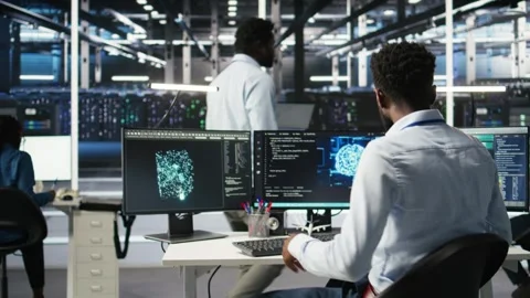 Server hub engineering team interprets AI generated data analytics graphs Stock Footage 309508078
